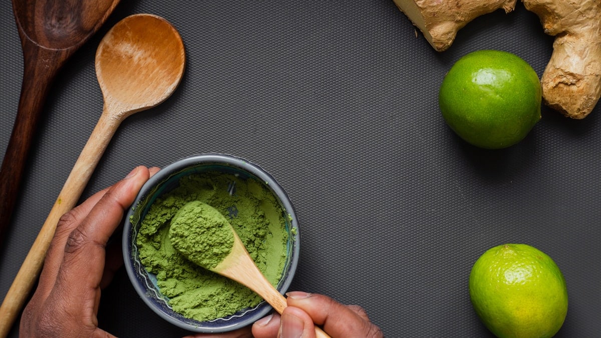 green liquid in stainless steel cup